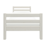 FLEXA white single bed, Scandinavian style, built-in slat base, child-friendly design in a kid’s bedroom setting.