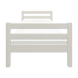 FLEXA white single bed, Scandinavian style, built-in slat base, child-friendly design in a kid’s bedroom setting.