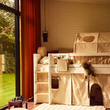 FLEXA loft bed and ROSE Back Rest Cushion in childrens room with soft toy, window, and child-safe rounded edges visible.