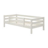 FLEXA single bed from WHITE collection, solid pine, white finish with safety rail and slatted base in child’s bedroom.