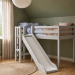 FLEXA High Bed from CLASSIC collection in grey with slide and safety rail in a green child’s bedroom.