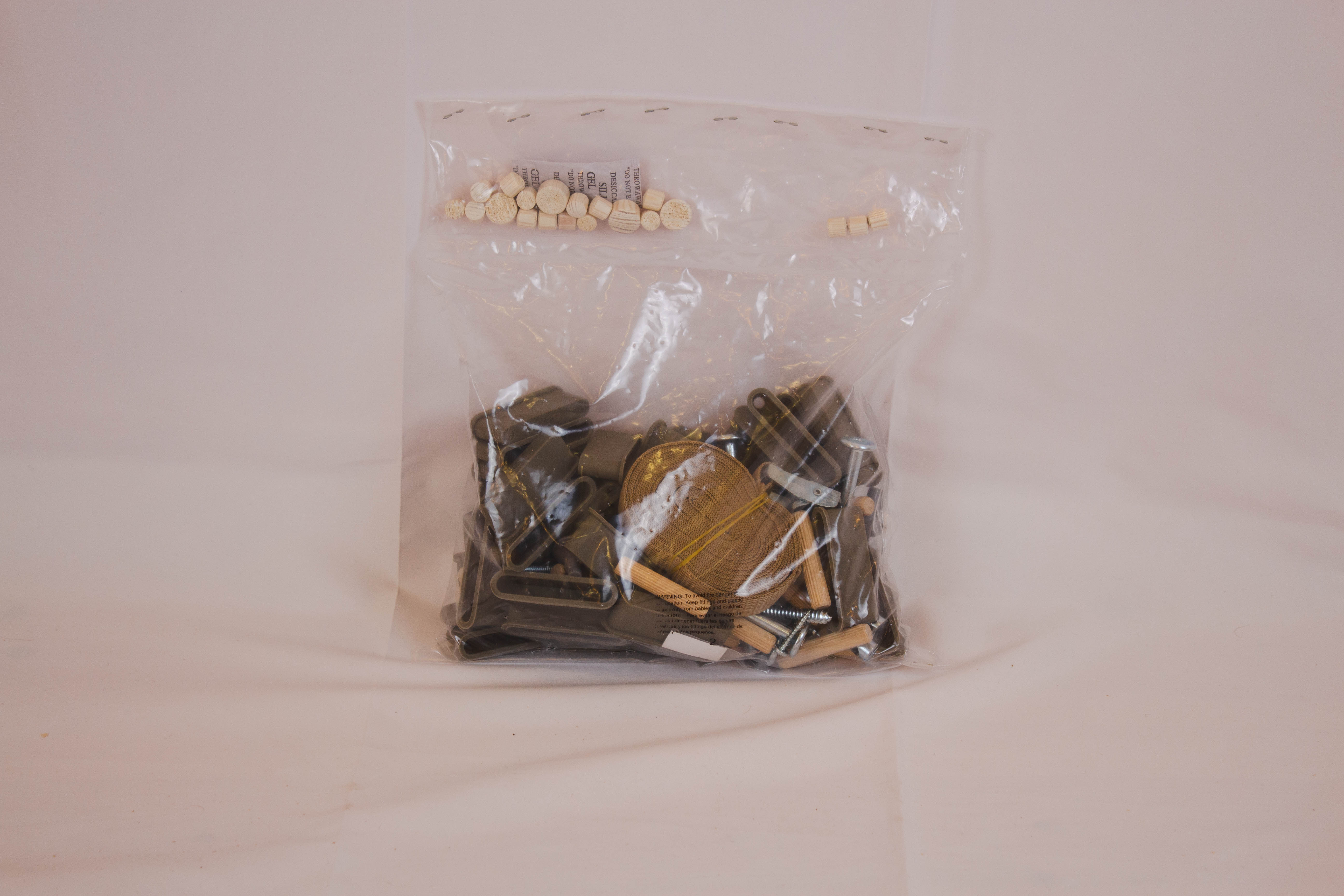 FLEXA CLASSIC single bed fitting bag in raw finish with screws, dowels, metal fasteners; child-safe hardware for bedroom assembly.